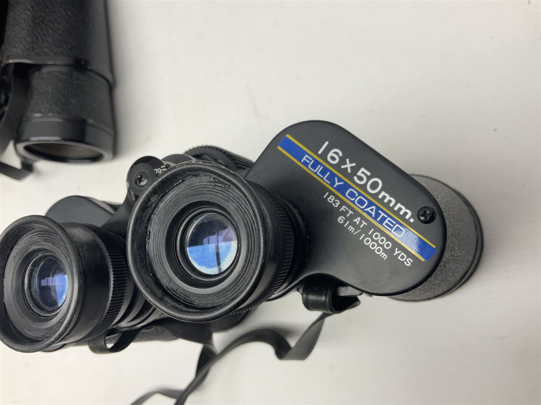 Pair of French binoculars by A.Tubeue Paris, together with three other pairs of binoculars including Telemax 5, Tasco Zip and Hanimax examples and a Panavue automatic slider viewer