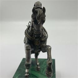 Modern silver model of a rearing horse, with ornate parcel gilt saddle and bridle, mounted upon a rectangular base, decorated with malachite panels to each side and upon four gilt bun feet, horse stamped 925, overall H14.5cm