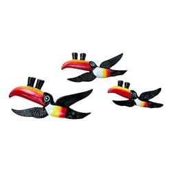 Three cast iron Guinness toucans in flight, together with two cast iron hooks