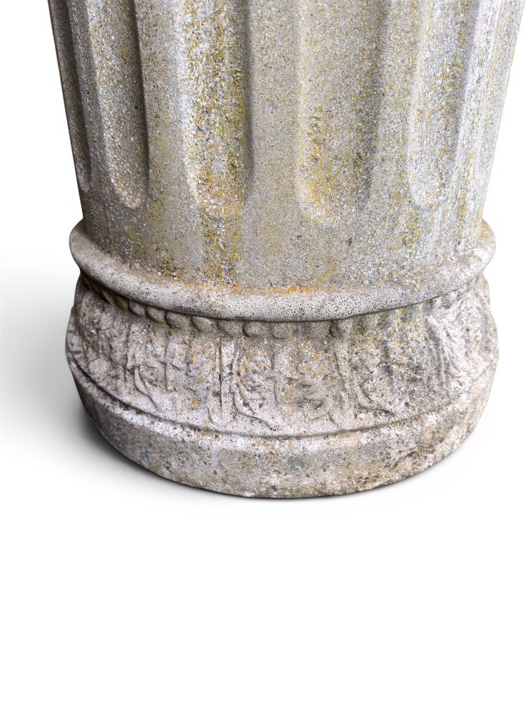 Four 20th century good quality weathered cast stone pedestal urns, circular lobed bowls with rope twist and lattice border, raised on squat base with fluted columns