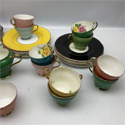 Shelley tea wares decorated in multiple colours with gilt edging and flowers inside, together with similar patterned tea wares from Aynsley etc 
