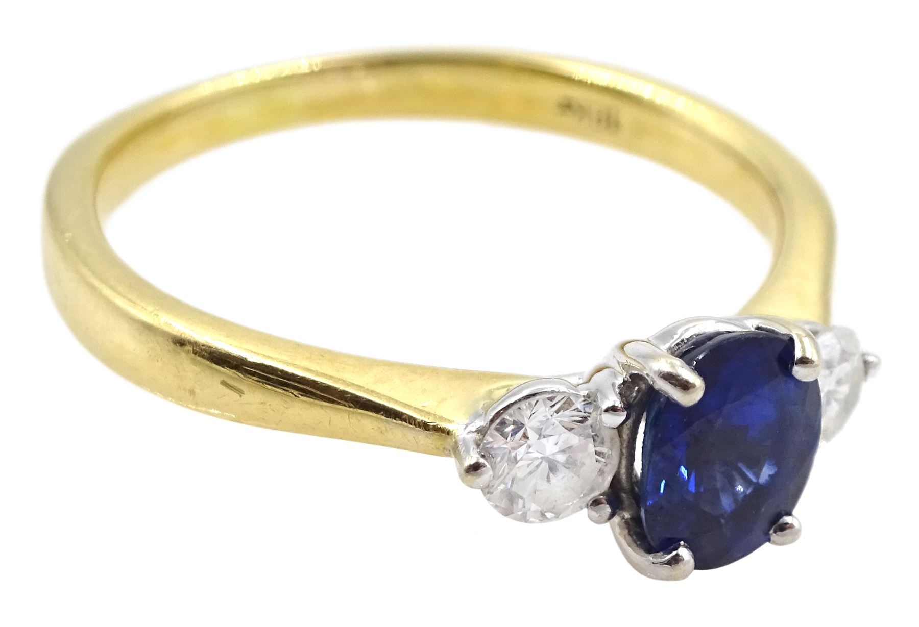 18ct gold three stone oval sapphire and round brilliant cut diamond ring, stamped 18KT, total diamond weight approx 0.30 carat, sapphire approx 0.80 carat
