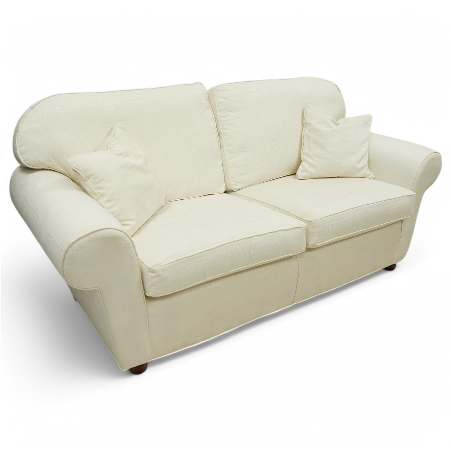 Large traditional shape two-seat sofa (W213xm, H101cm, D94cm); together with matching armchair (W116cm); and footstool (53cm x 78); upholstered in cream textured fabric