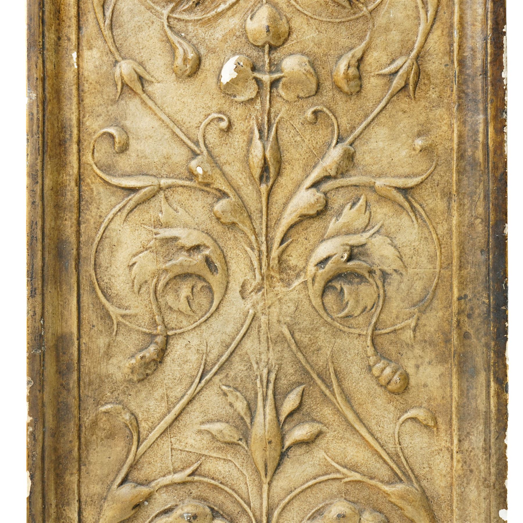 D Brucciani, London - After the antique -  A relief moulded plaster panel No2538 with stylised trailing leaves, flower heads and a mask 62cm x 22cm