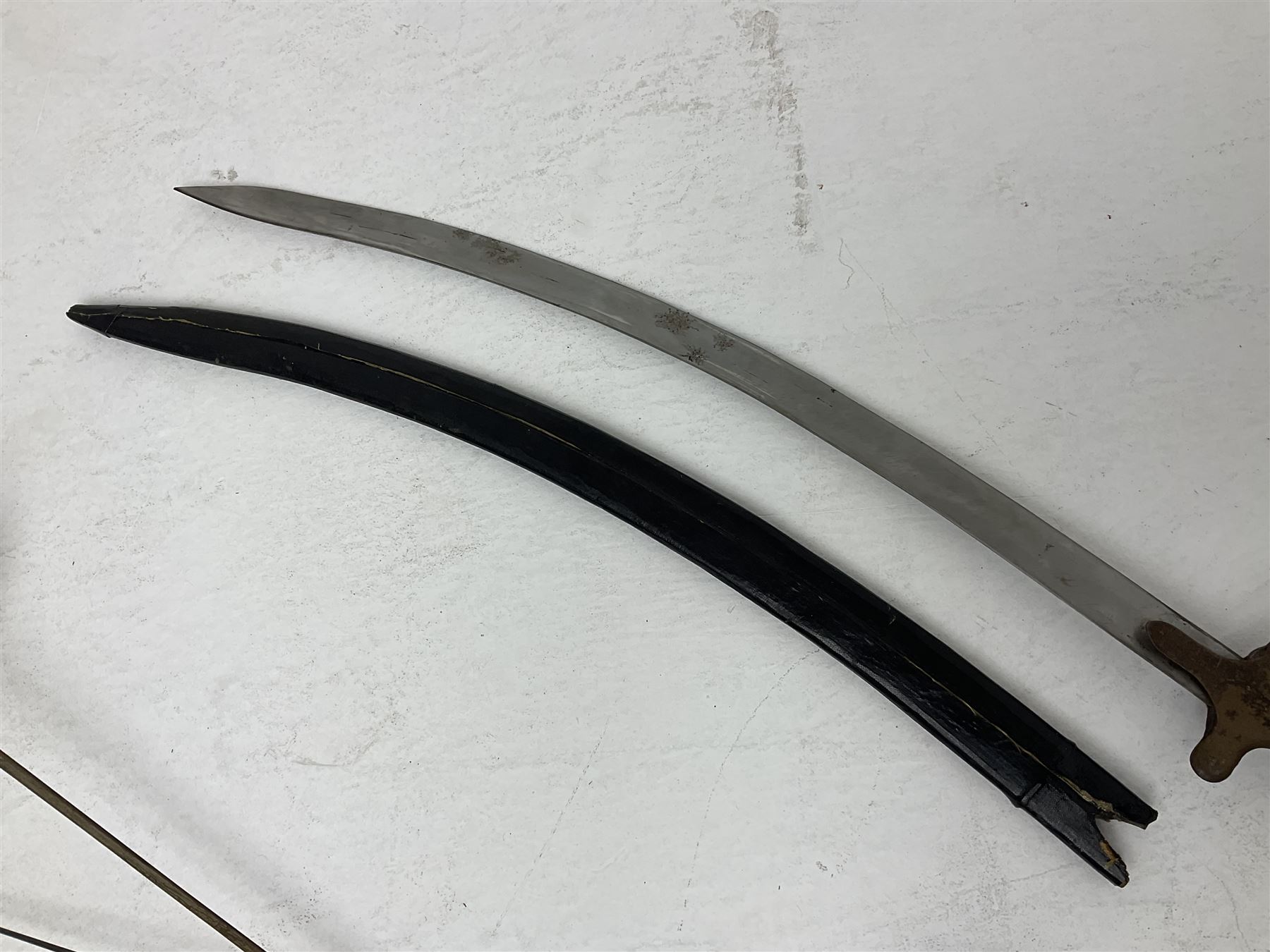 20th century Indian Tulwar sword with 71cm plain curving steel blade and iron hilt with extended langets, knopped grip and spiked pommel; in canvas covered wooden scabbard L87.5cm overall; together with five fencing swords comprising four foils and one epee, three marked Leon Paul, one in carrying case (6)