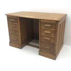  Vintage oak twin pedestal desk, two slides, eight drawers, plinth base, W122cm, H78cm, D68cm  