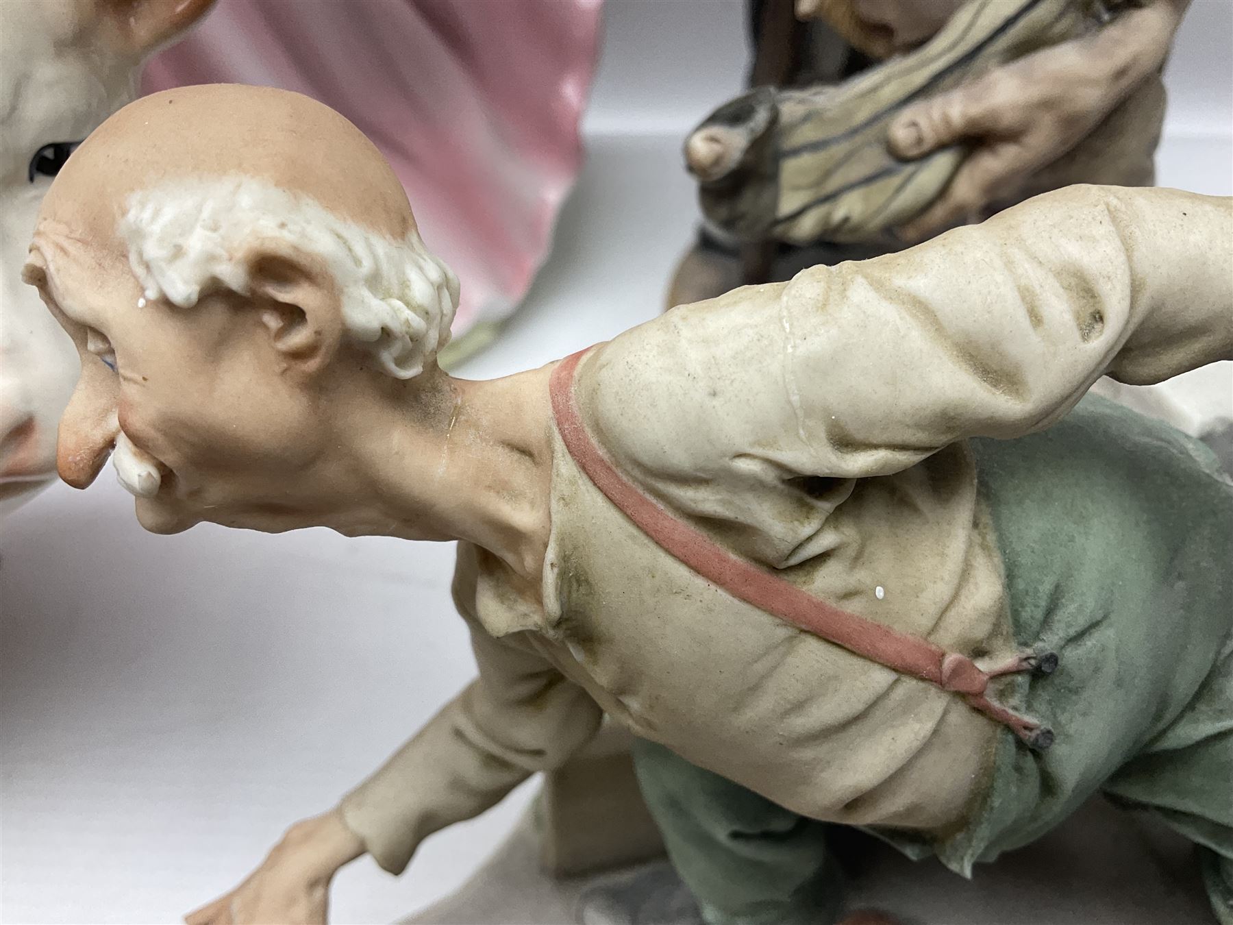 Two Capodimonte figures together with Melba Ware bull and other ceramics 