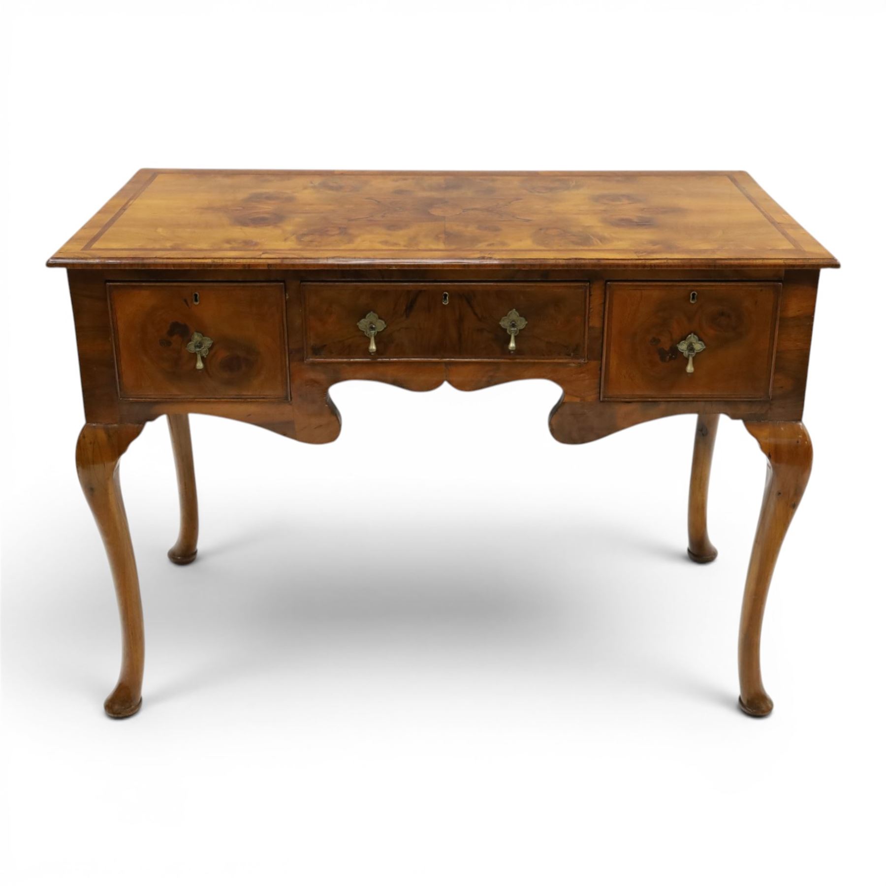 Queen Anne Design walnut kneehole desk with matching chair, rectangular figured top with crossbanding, three frieze drawers, raised on cabriole supports, the chair with serpentine front raised on cabriole supports