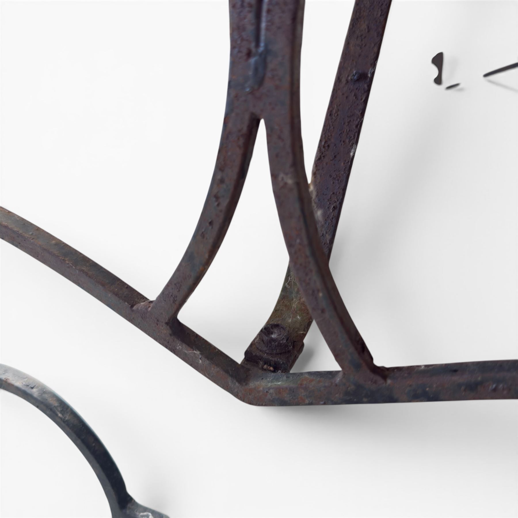 Cast iron garden table, with rectangular weathered slatted wooden top, raised on iron strapwork supports of scrolling form, in black painted antique finish 
