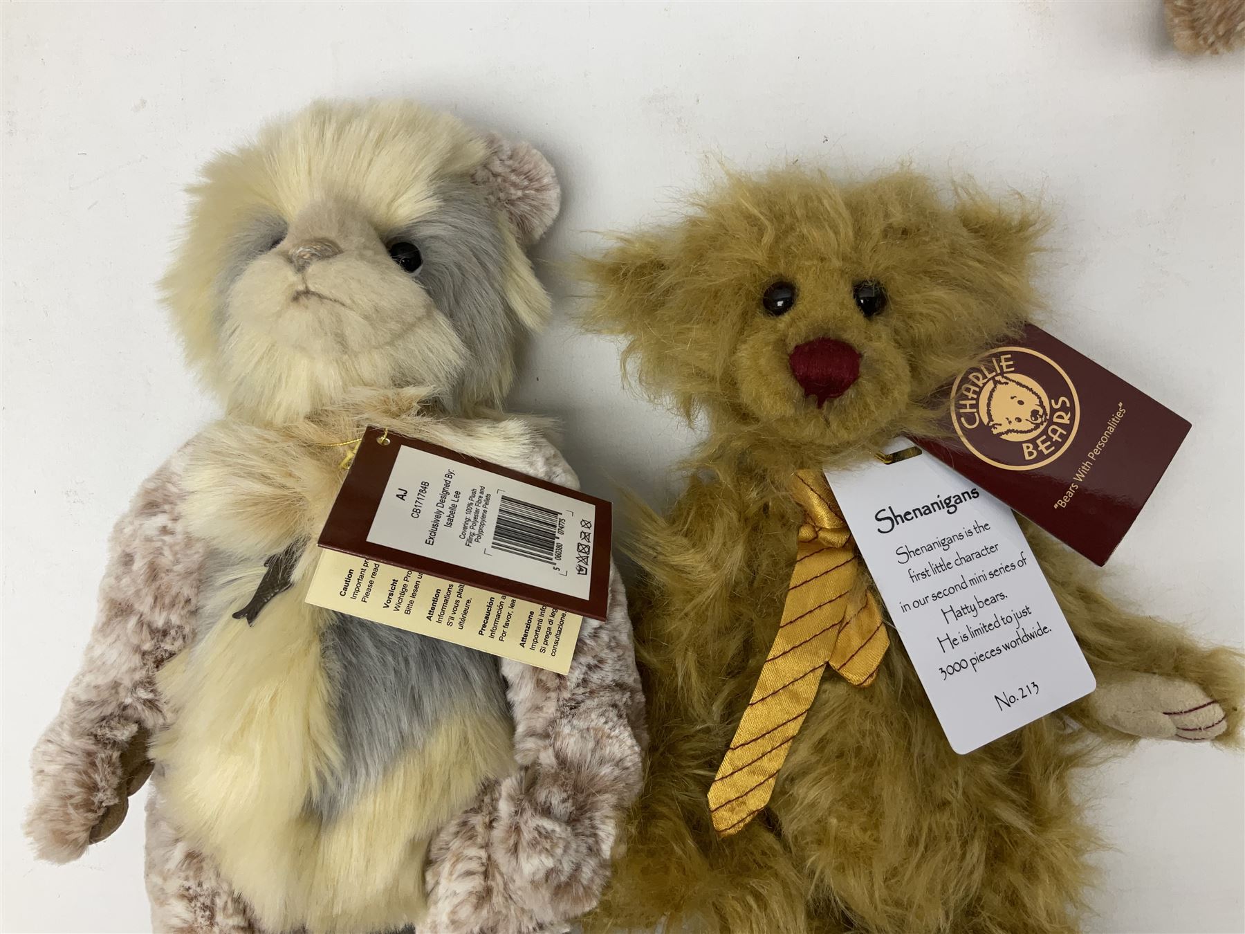 Seven Charlie Bears, comprising limited edition Anniversary Cheesecake SJ5471, designed by Isabelle lee, 431/500, Nuala CB185169, Liddy CB161648A, Philomena CB151592, and AJ CB171784B, each designed by Isabelle Lee, plus Shenanigans CB205243O, and another example lacking tag 