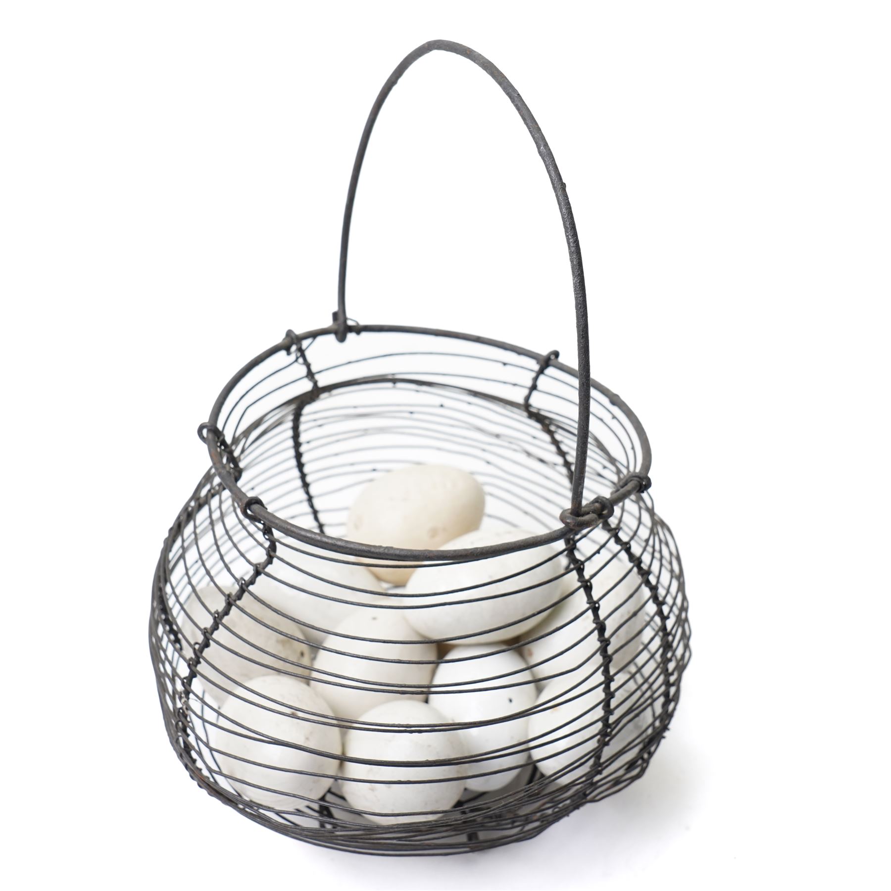 Two wire crocks, each containing 11 broody hen ceramic dummy eggs, four marked 'Caperns'