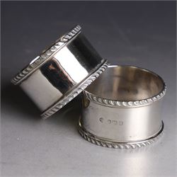 Pair of early 20th century silver napkin rings, plain circular form with oblique gadrooned rim, no engravings, hallmarked William Hutton & Sons Ltd, Sheffield 1912