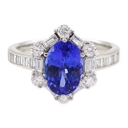 18ct white gold tanzanite and diamond cluster ring, oval tanzanite, with baguette and round brilliant cut diamond surround and baguette cut diamond shoulders, stamped 750, tanzanite approx 1.80 carat, total diamond weight approx 0.55 carat