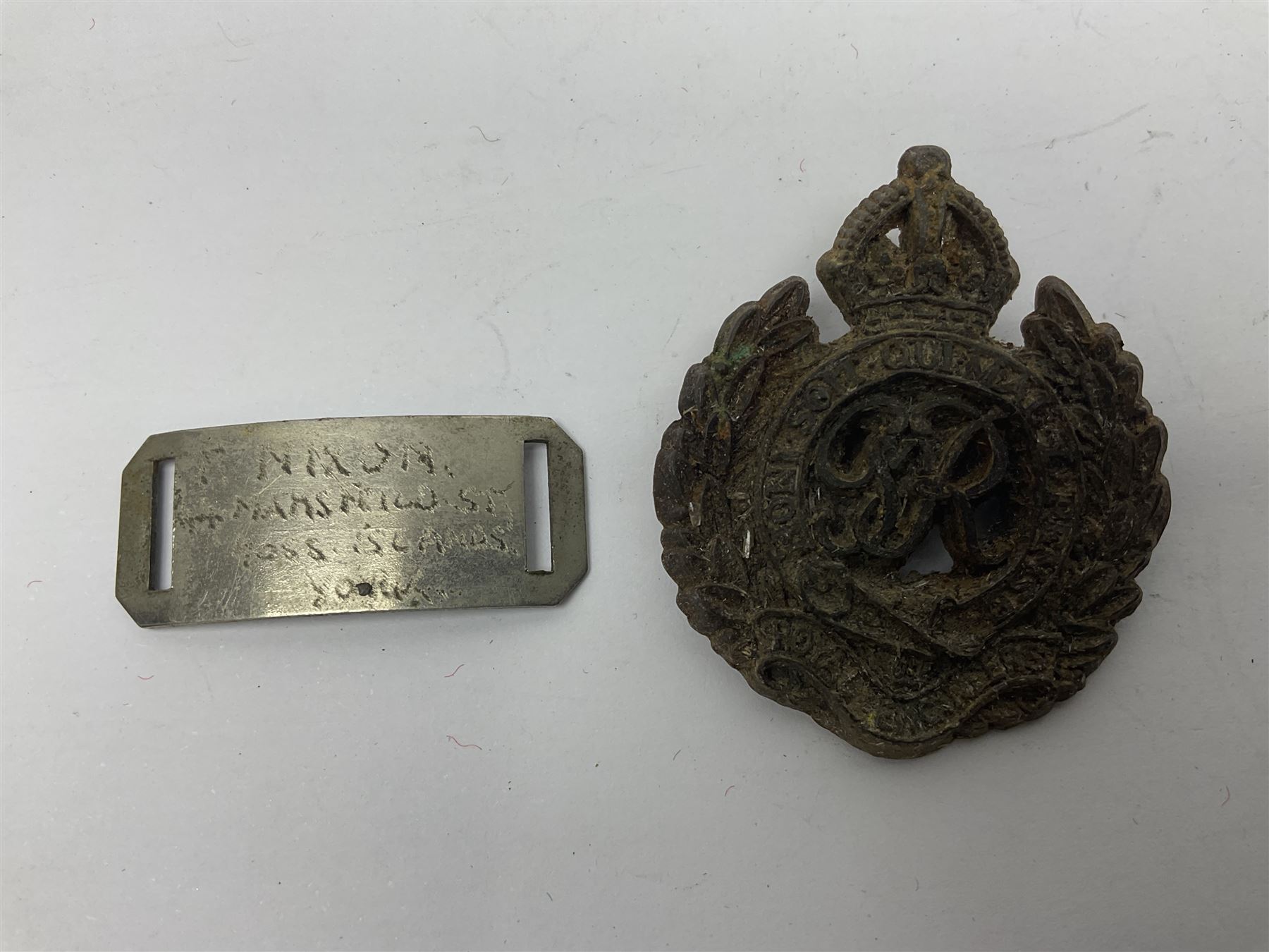 Made-up group of three WWI medals comprising 1914 Star awarded to 23598 Gnr. F. Jefferson R.G.A., British War Medal and Victory Medal with names removed; with ribbons on wearing bar; 1942 Motorist's Medal and small quantity of cap badges, Royalty badges etc