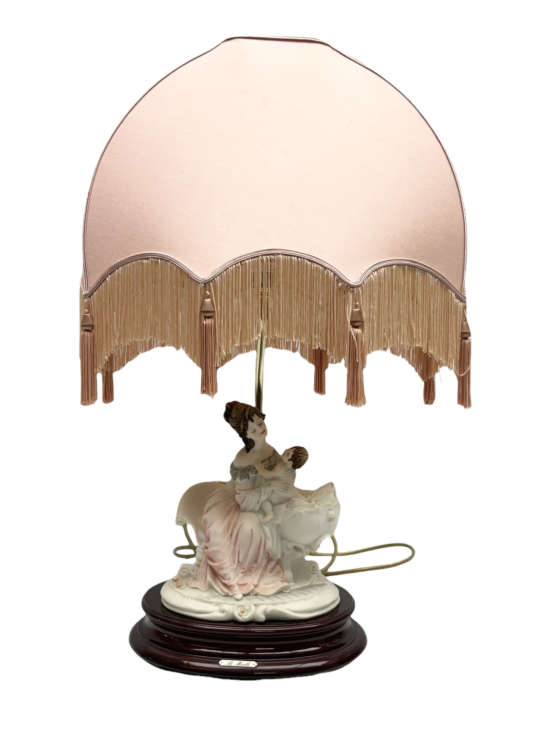 Capodimonte figural table lamp modeled as a woman and baby, signed B.Merli, with a tasseled shade, H59cm