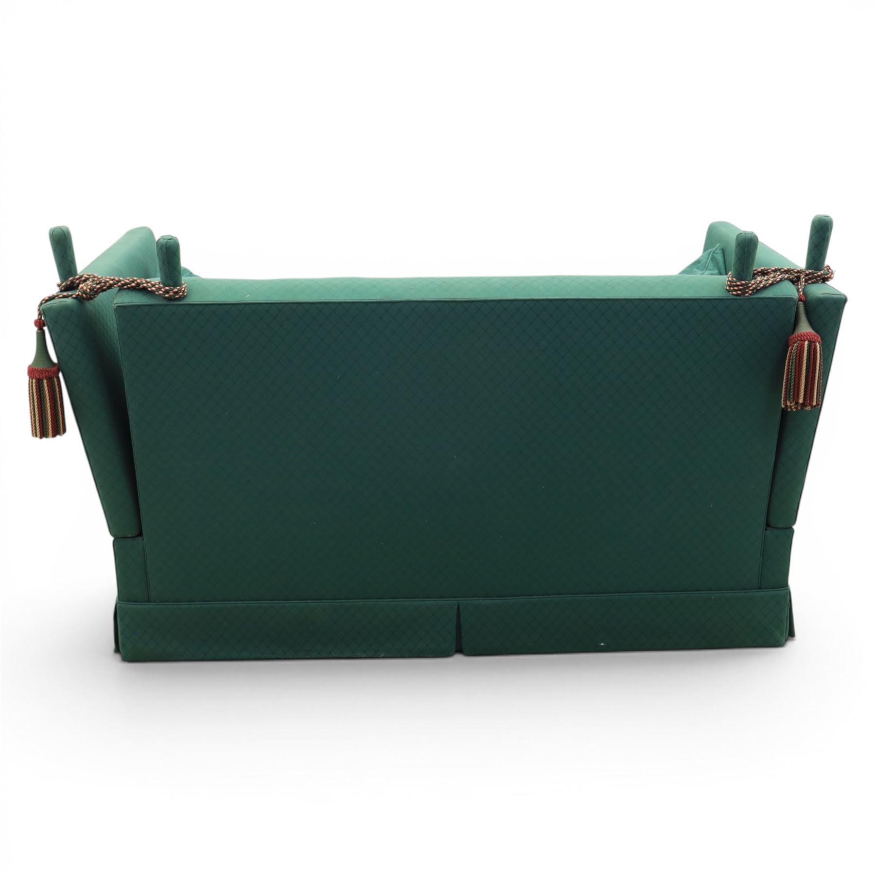 Late 20th century two-seat Knole sofa, covered in green woven fabric with lattice pattern, high panelled back and hinged drop arms secured by braided cords, loose cushioned seat and back with additional scatter cushions, on plinth base
