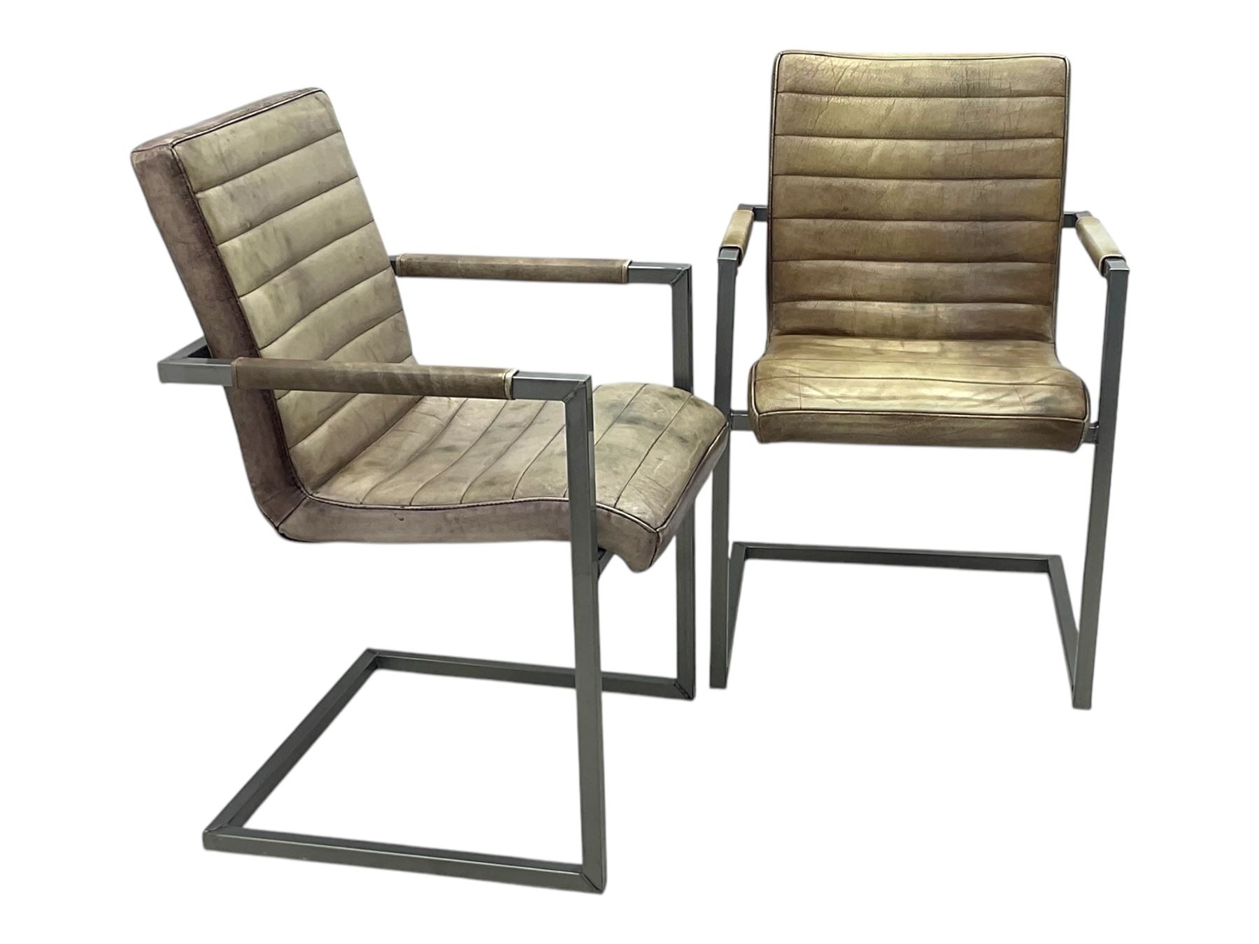 Pair of contemporary industrial style armchairs, each featuring a squared steel cantilever frame with upholstered arms, the seat and back finished in channel-stitched distressed tan faux leather