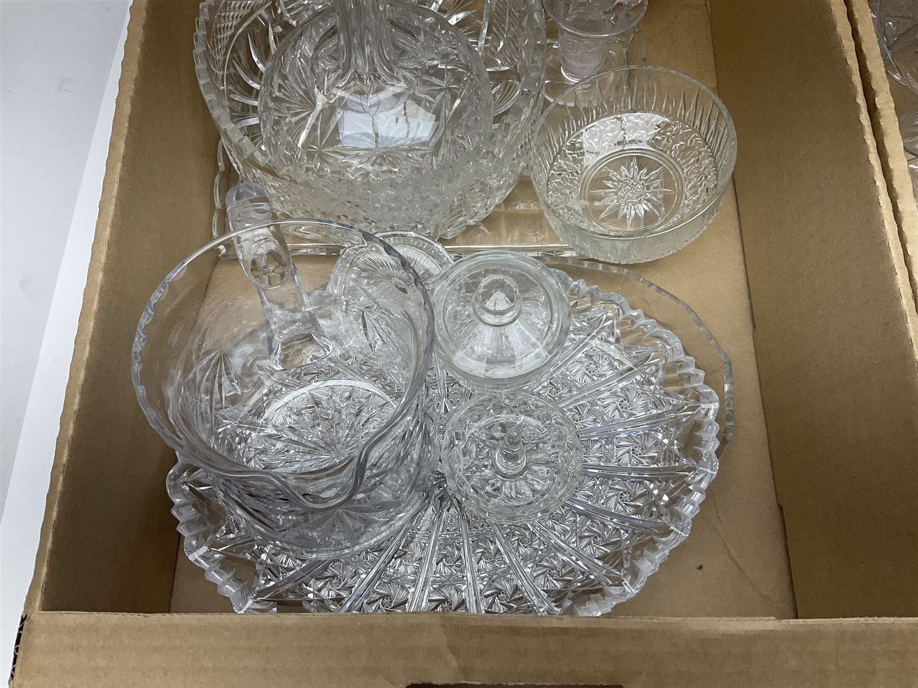 Four boxes of glassware to include painted vases, jugs, drinking glasses, art glass vase etc