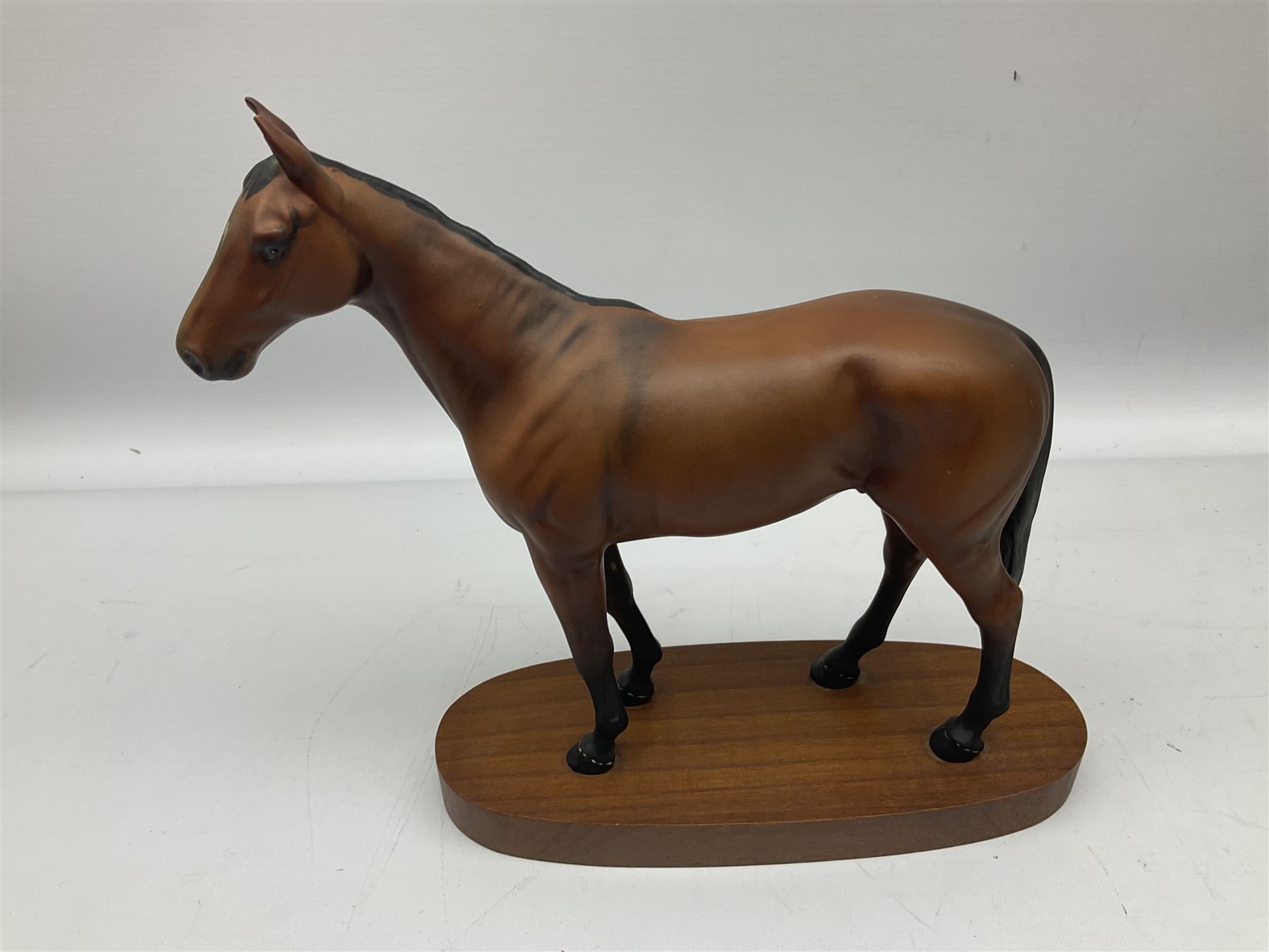 Beswick 'Mill Reef' horse figure, on a wooden plinth together with Beswick Ware horse figure 'Red Rum' on wood plinth, both with printed mark beneath
