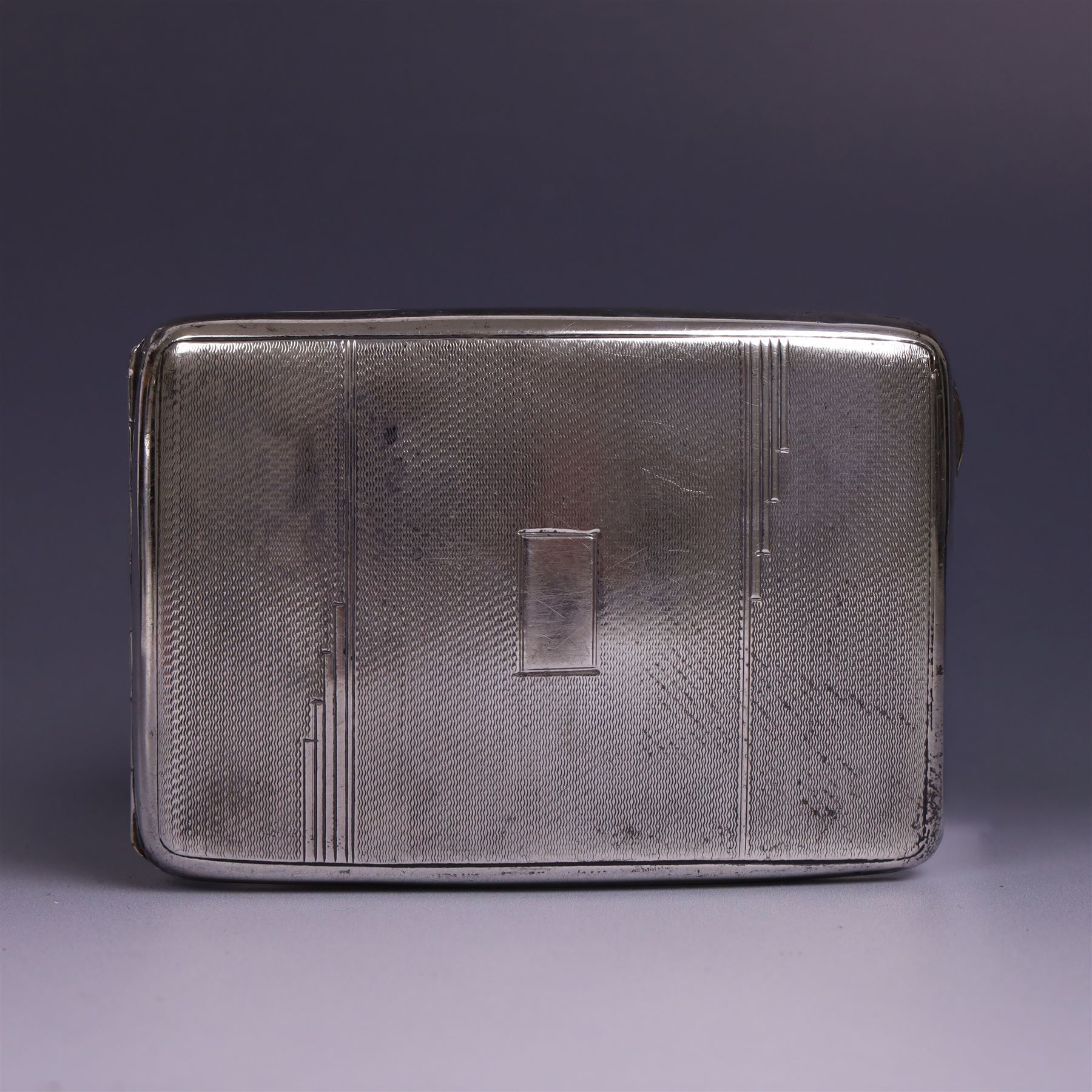 1930s silver cigarette case, of curved rectangular form with engine turned decoration and vacant cartouche, hallmarked Joseph Gloster Ltd, Birmingham 1934 and a 1930s silver sweetheart compact with engine turned decoration and enamel Royal Engineers crest, hallmarked Crisford & Norris Ltd, Birmingham 1939, cigarette box L12cm, H8cm