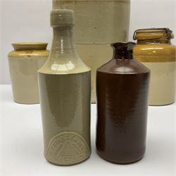 Large 2 gallon stoneware flagon, stamped 'John Soulby Wine Merchant Malton 2 Gall', together with a collection of similar stoneware jars and bottles, largest H40.5cm