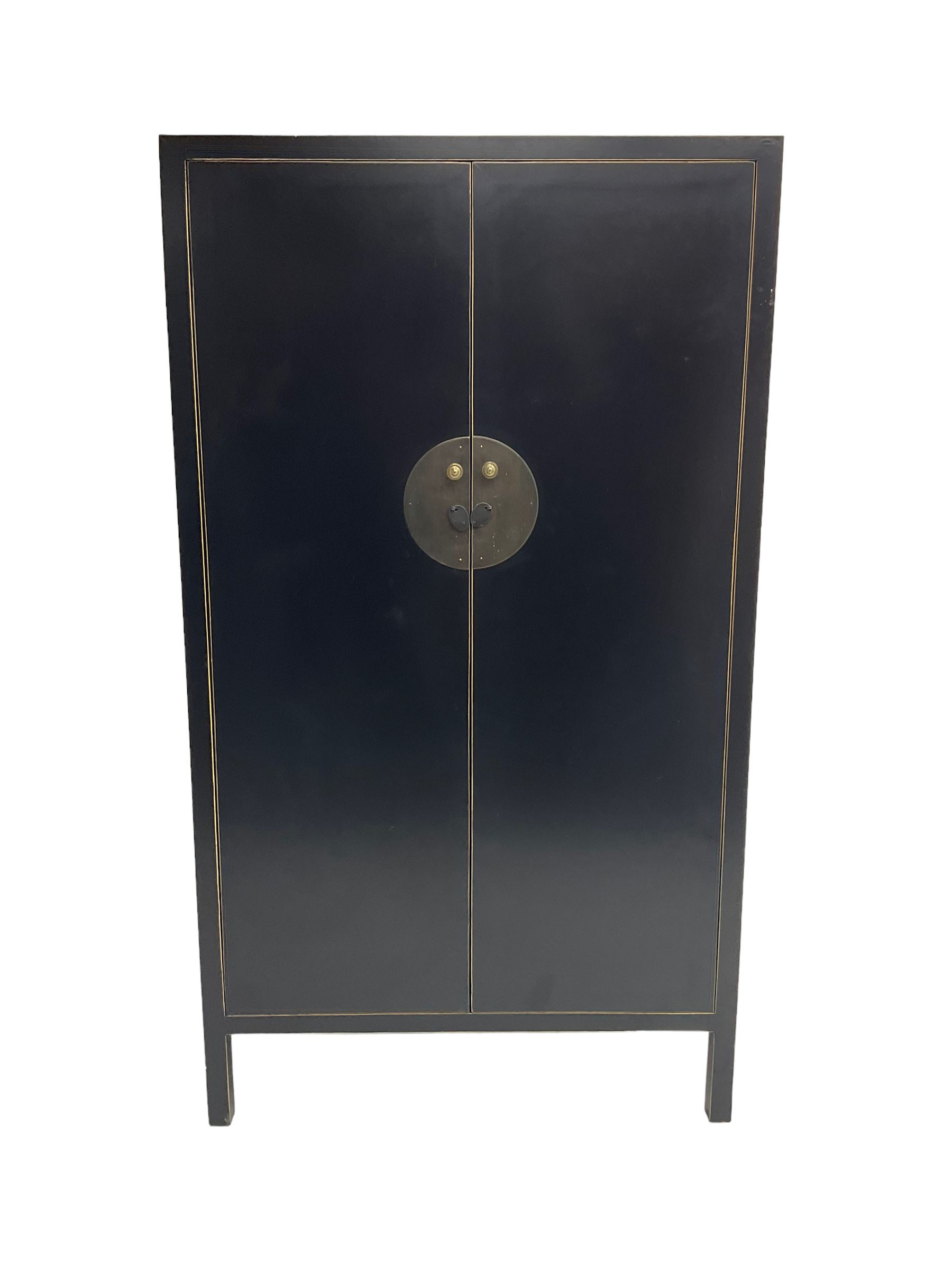 Chinese design black lacquered wardrobe, two cupboard doors enclosing hanging rail and two drawers