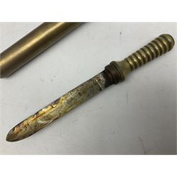 French Naval divers brass handled knife, the 20.5cm single edged steel blade held in place with wooden wedges, tapering ribbed grip with domed pommel and original screw-on scabbard with drain hole L38cm overall