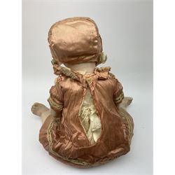 German bisque head doll with applied hair, sleeping eyes and open mouth with teeth and fixed tongue, on composition body with jointed limbs, marked 'P.M. 914 Germany 14' H65cm