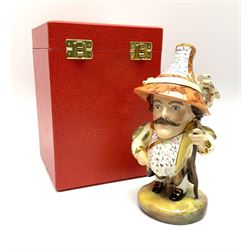 A Royal Crown Derby Mansion House dwarf, wearing 17th century cavalier costume, with floral waistcoat and hat detailed with play bill of the Theatre Royal, Haymarket, H18cm, with printed mark beneath and signed S.whitbread, with makers box. 