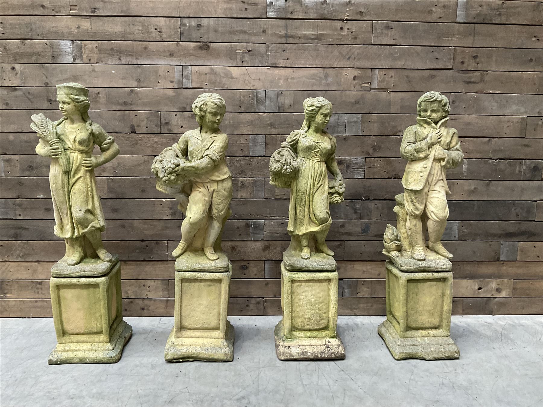 The Four Seasons - set of four cast stone garden figures on plinths