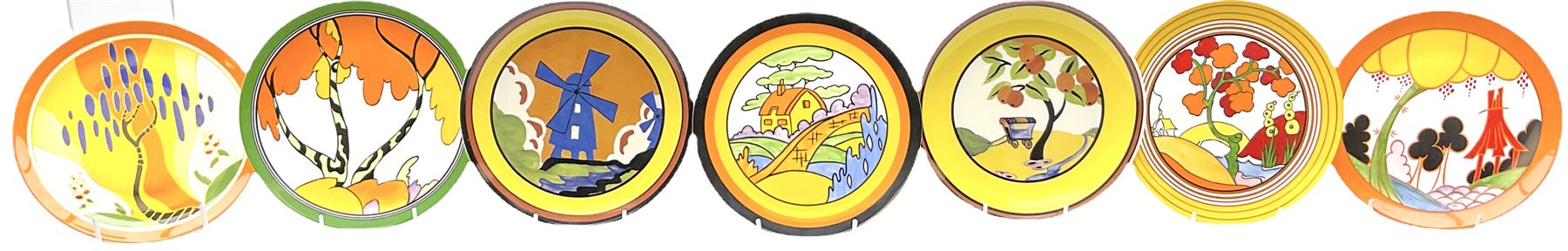 Seven limited edition Wedgwood Clarice Cliff plates, comprising Orange Roof Cottage, Caravan, Windmill, Windbells, Summerhouse, Honolulu and Bridgewater D20.5cm. 