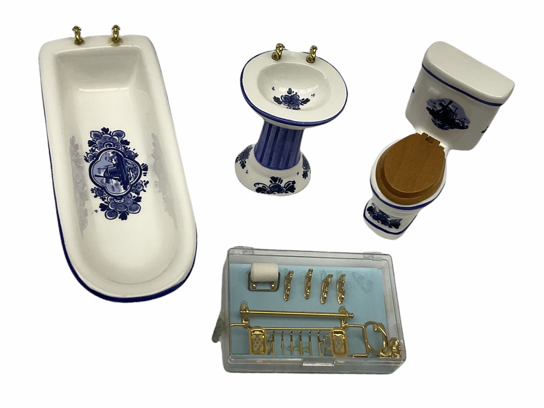 Georgian style wooden double fronted three-storey dolls house with pale blue stucco finish under a faux tiled roof with two chimney stacks, the double hinged front opening to reveal six fully decorated rooms with floor coverings, central staircase, porcelain fitted bathroom, kitchen with deep white sink and Aga cooker, electric lighting with adaptor, fully furnished with French style and other furniture, grand piano etc, and comprehensive range of accessories H82cm W61cm D31cm