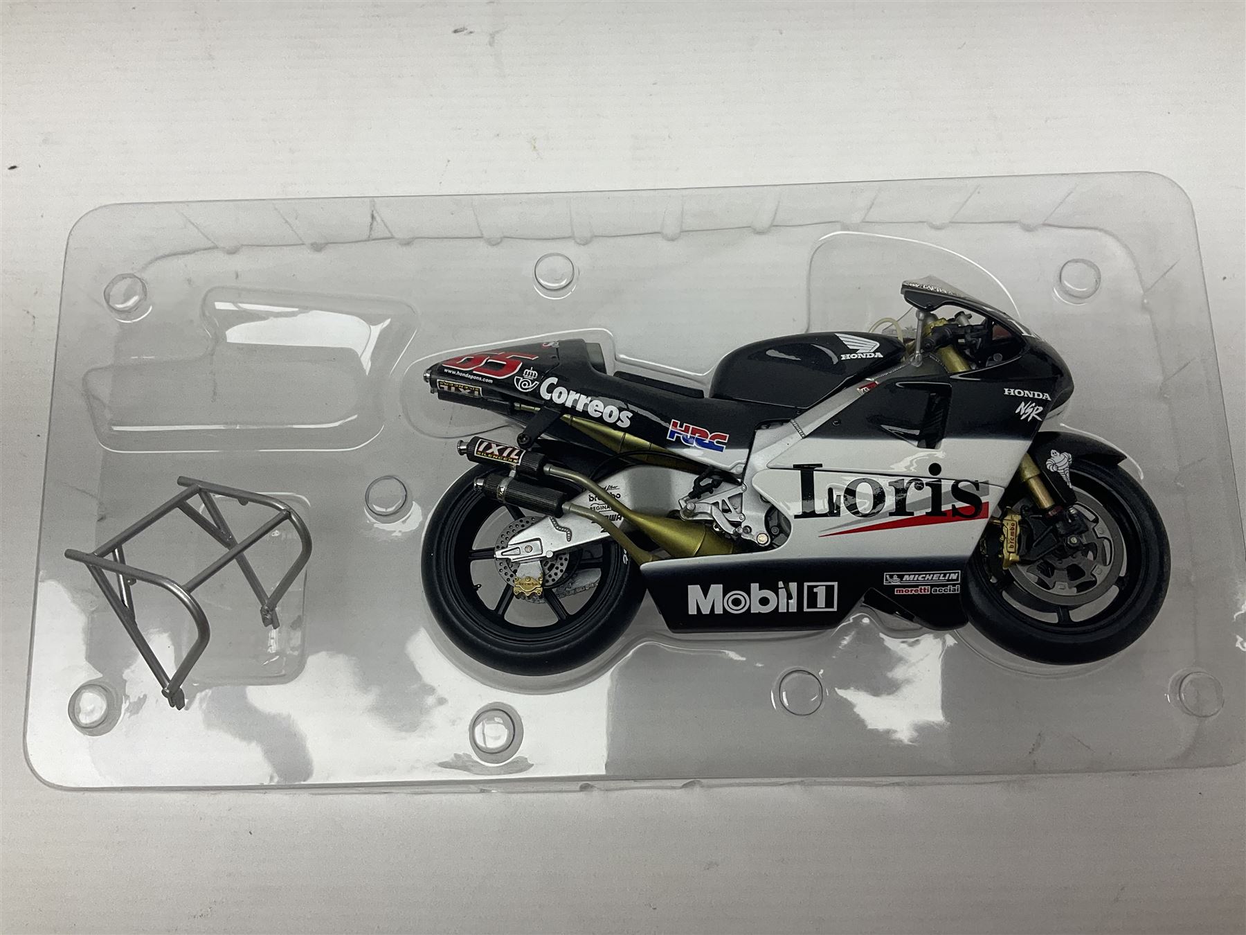 Three Minichamps 1:12 scale die-cast models of motorcycles - Suzuki GSX-R1000 Team Alstare Suzuki Corona Extra Troy Corser WSB 2005; Yamaha YZR-M1 Gauloises Yamaha Team Colin Edwards MotoGP Laguna Seca 2005; and Honda NSR 500 Loris Capirossi MotoGP 2002; all boxed (3)