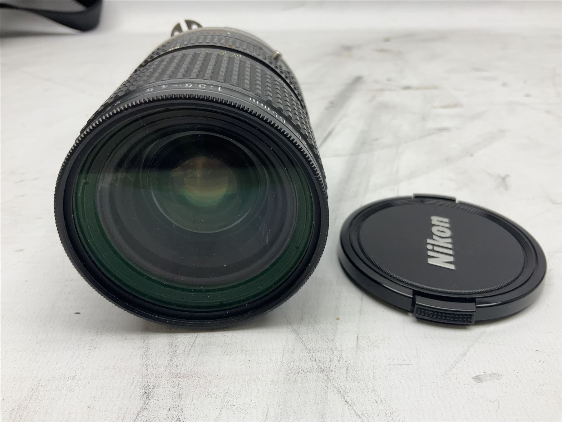 Nikon F3 SLR camera, serial number 1583609; Nikon 50mm 1:1.8 lens; Nikon 28-85mm 1:3.5-4.5 zoom lens; Vivitar MC 2X-3 Tele Converter, and a Nikon Speedlight SB-16 flash