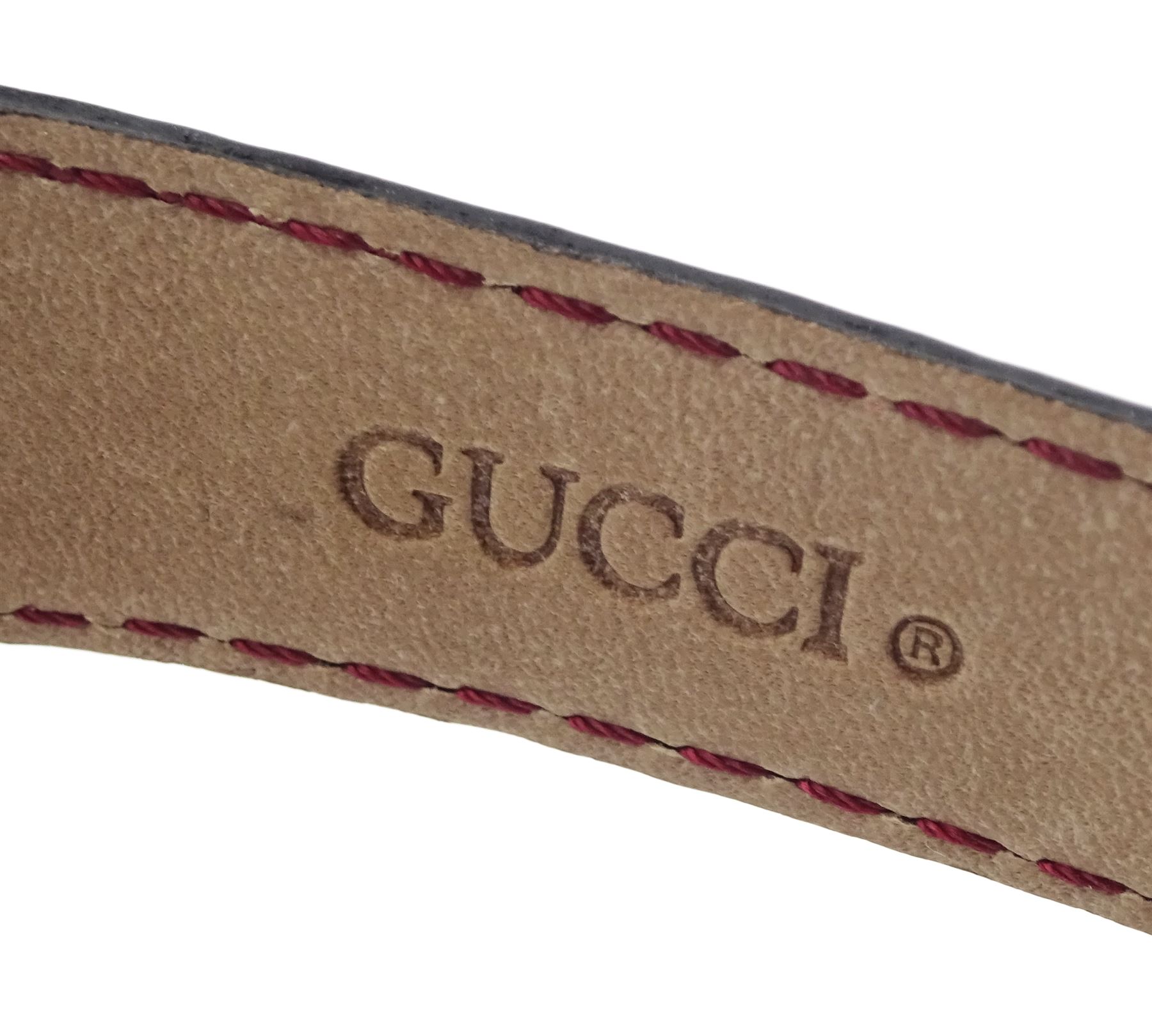Gucci gold-plated rectangular quartz wristwatch, Ref. 2600M, red and silvered dial, on original red leather strap, boxed