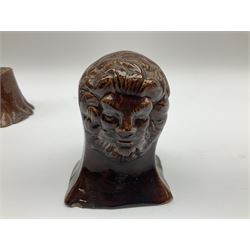 Pair of 19th century treacle glaze furniture/sash window rests modelled as lions, H12.5cm