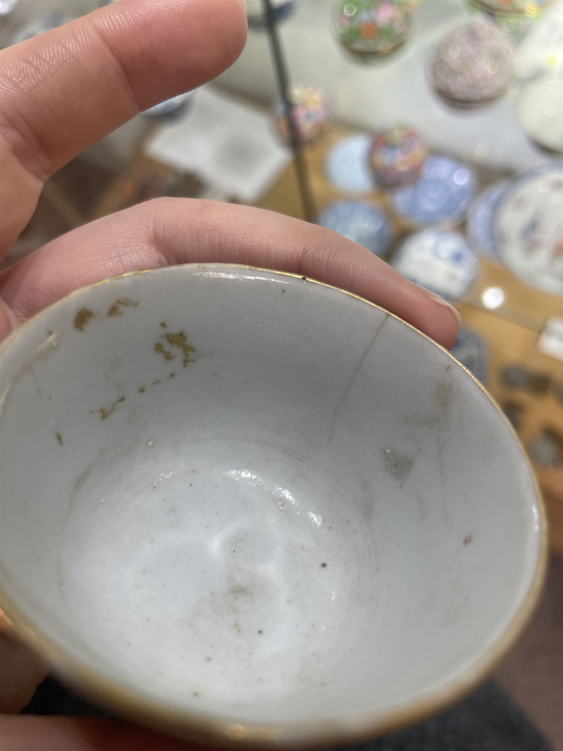 Group of eight 18th century and later Chinese famille rose and similar painted teabowls and dishes, to include unmarked peony cup, small cup decorated with flowers and butterfly, cup decorated with female figure gazing out of a window in a Buddhist temple with indistinct square character mark to base, pair of saucers unmarked, and others with character scenes unmarked (8)
