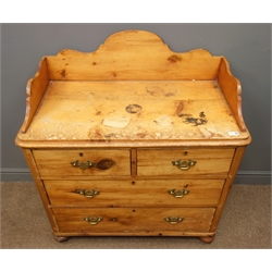  Early 20th century waxed pine washstand, raised shaped back and sides, above two short and three long drawers on bun feet, W94cm, H107cm, D49cm,   