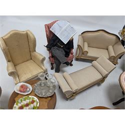 Dolls house furniture, including sofa, chairs, foot stools, fireplace, sideboards, five figures, mirrors, paintings and accessories