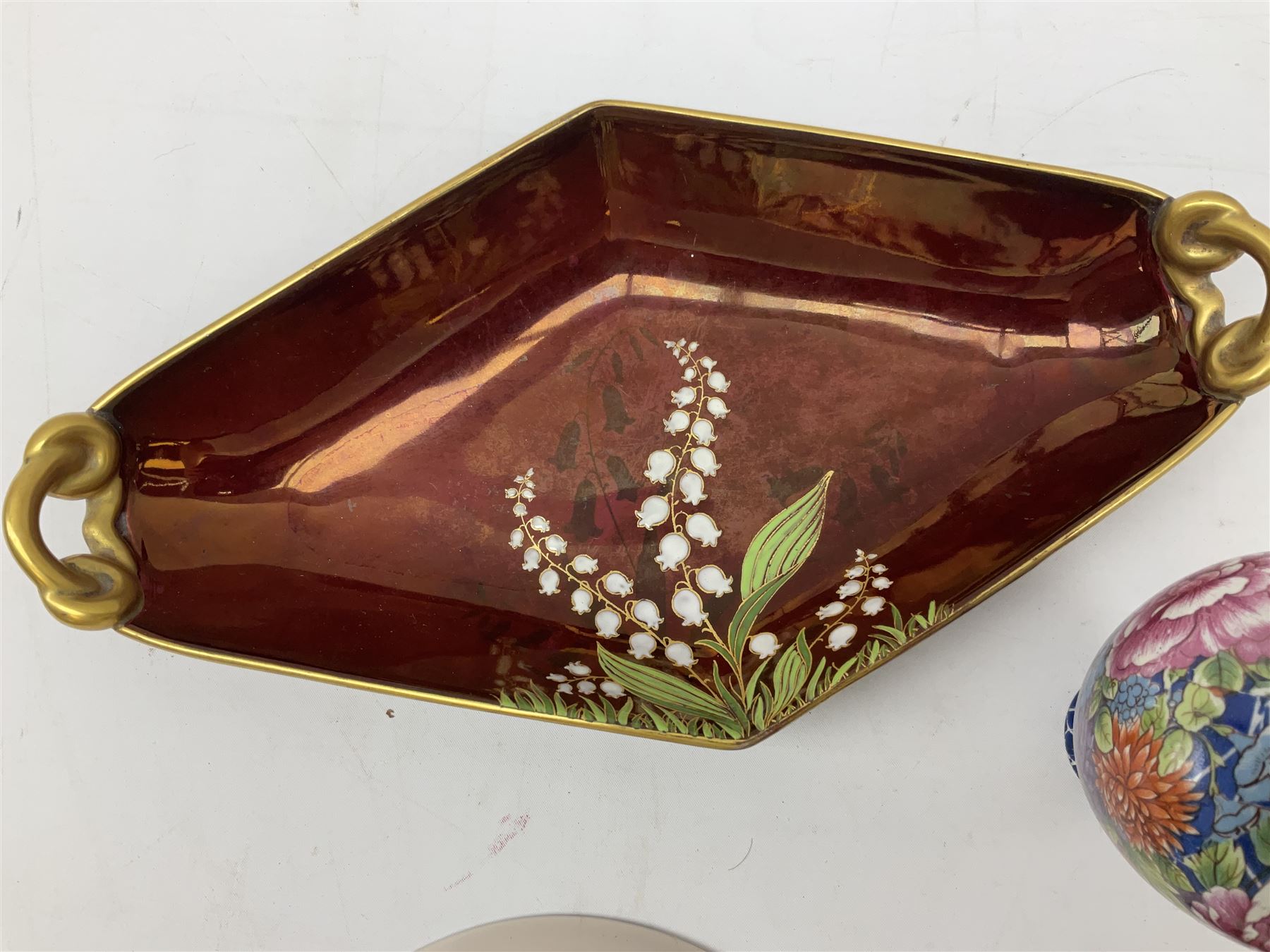 Shelley Cloisonne pattern vase, Carlton Ware Rouge Royal pattern twin handed dish and ash tray decorated with pagoda and Poole Delphis shallow bowl with geometric decoration on orange ground, largest L28cm