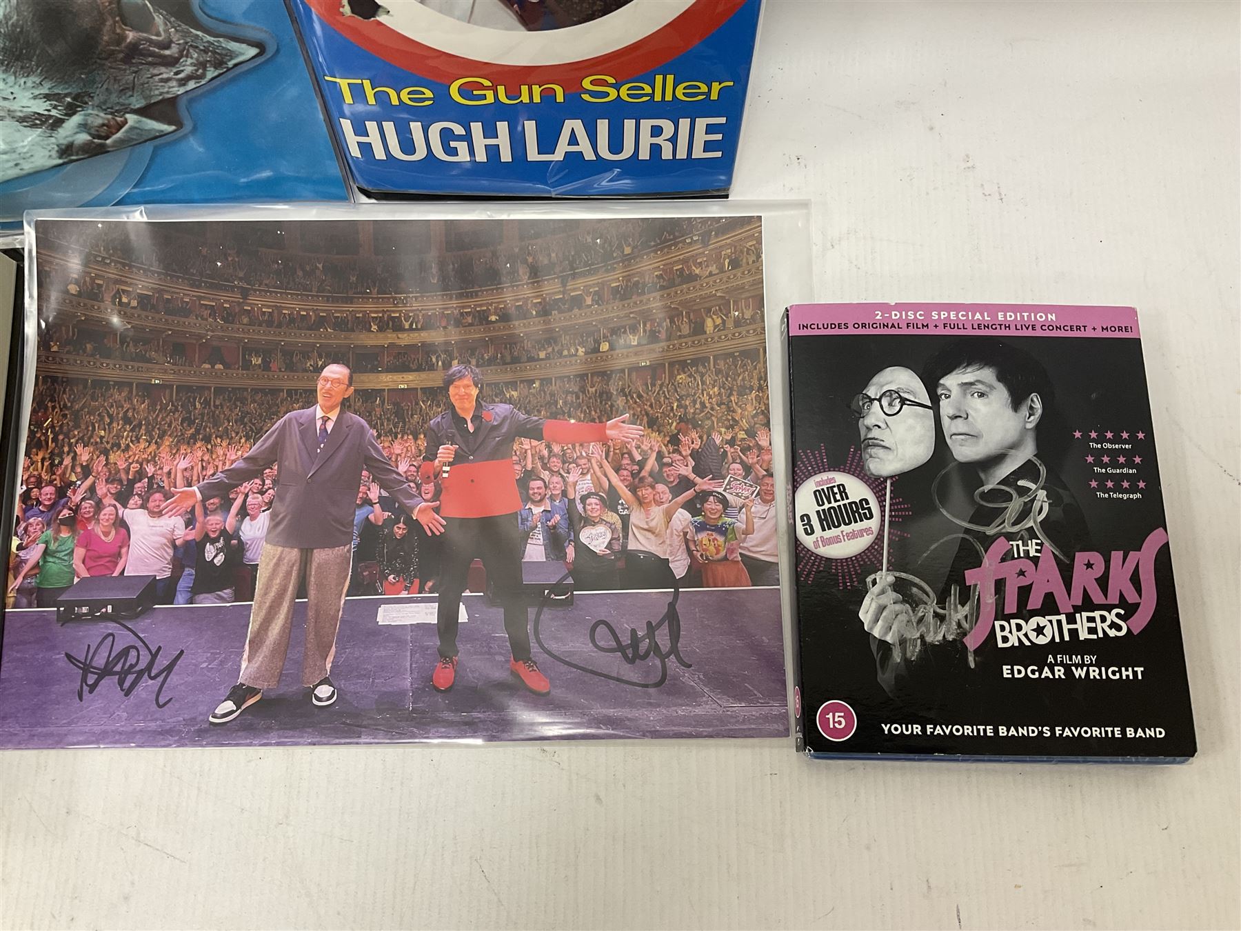 Signed books and ephemera, including Michael Palin Diaries 1969-1979, The Sparks Brothers, Hugh Laurie The Gun Slinger etc 