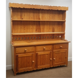  Pine kitchen dresser, shaped cornice, two plate racks, three drawers and three cupboard doors, tapered supports, W172cm, H183cm, D45cm  