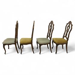 20th-century set of four French provincial-style stained beech dining chairs, pierced cartouche back with fan carving, with a scroll moulded frame above a padded serpentine seat on cabriole legs 