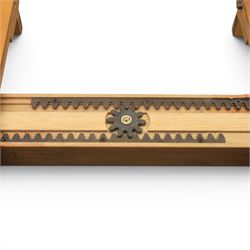 Modern Art Deco design walnut extending dining table, rectangular top with rounded moulded edge, geometric parquetry veneered panels, extending action with additional leaf extending to 220cm, on twin panelled pedestal supports with stepped plinth feet