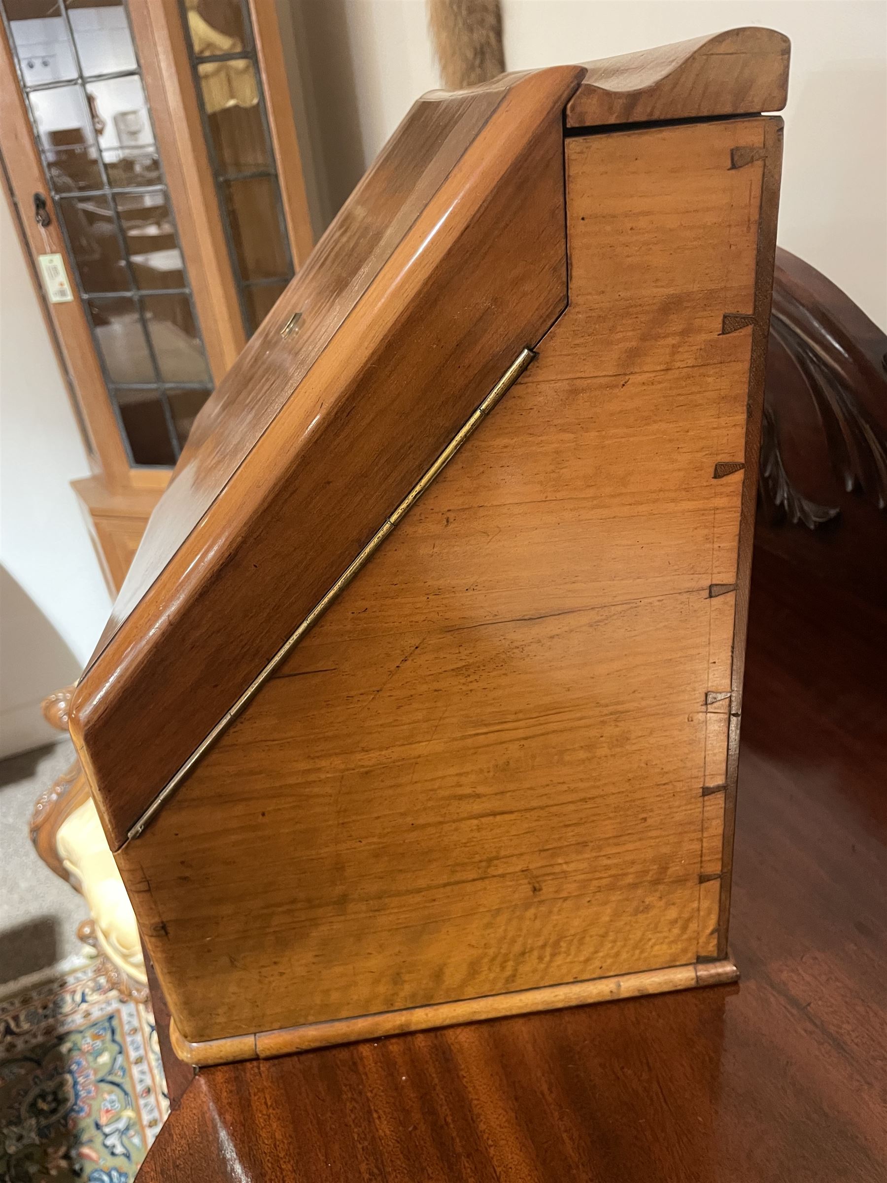 19th century burr walnut correspondence box, the sloped front opening to reveal a fitted interior with perpetual calendar, letter racks, and pen tray between two inkwell recesses, above a pull out draw with recessed brass handle, H41cm L40.5cm D28.5cm