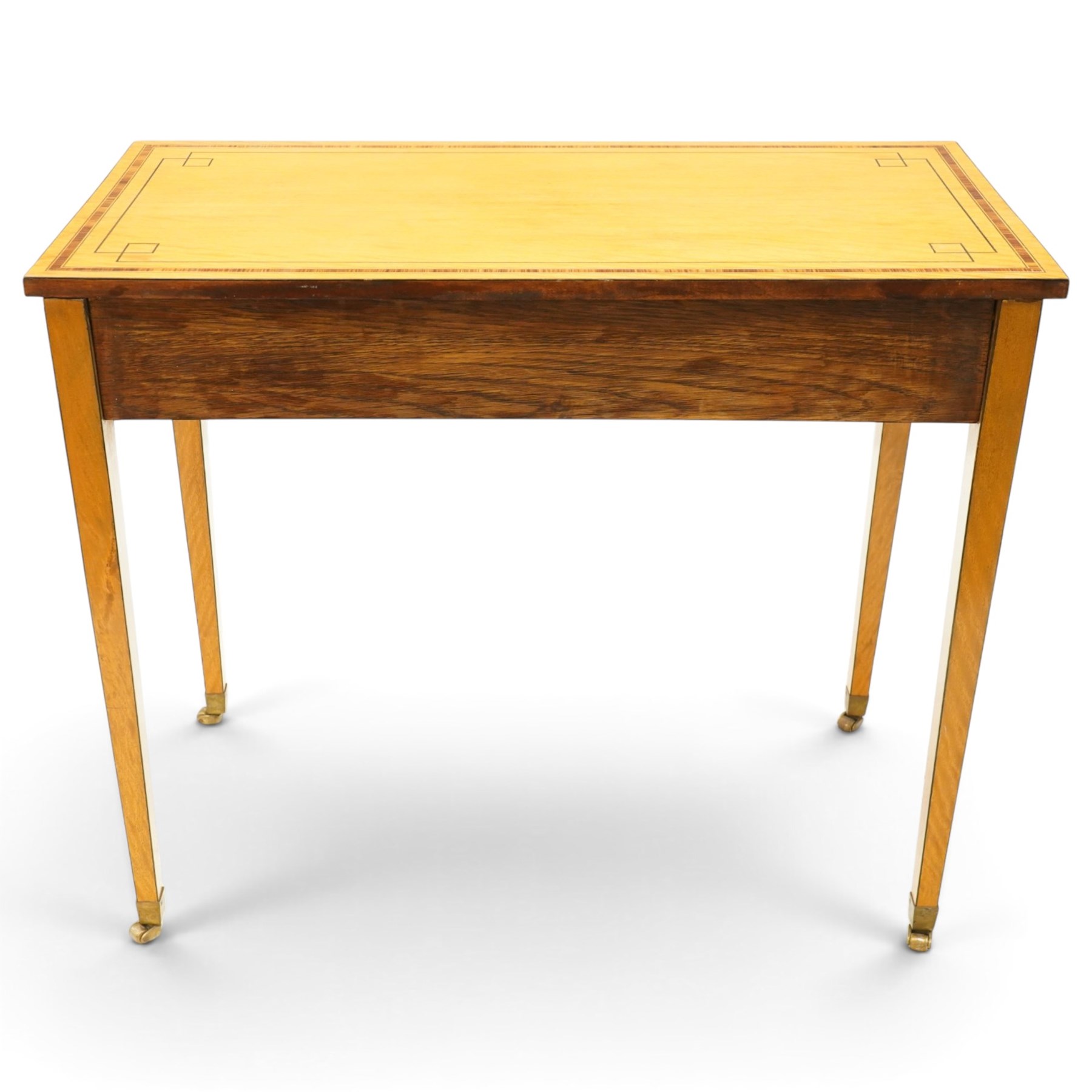 Pair of George III design inlaid satinwood console or side tables, rectangular top with mahogany cross-banding and ebony stringing, fitted with two drawers with brass ring handles, on square tapering supports with brass cups and castors