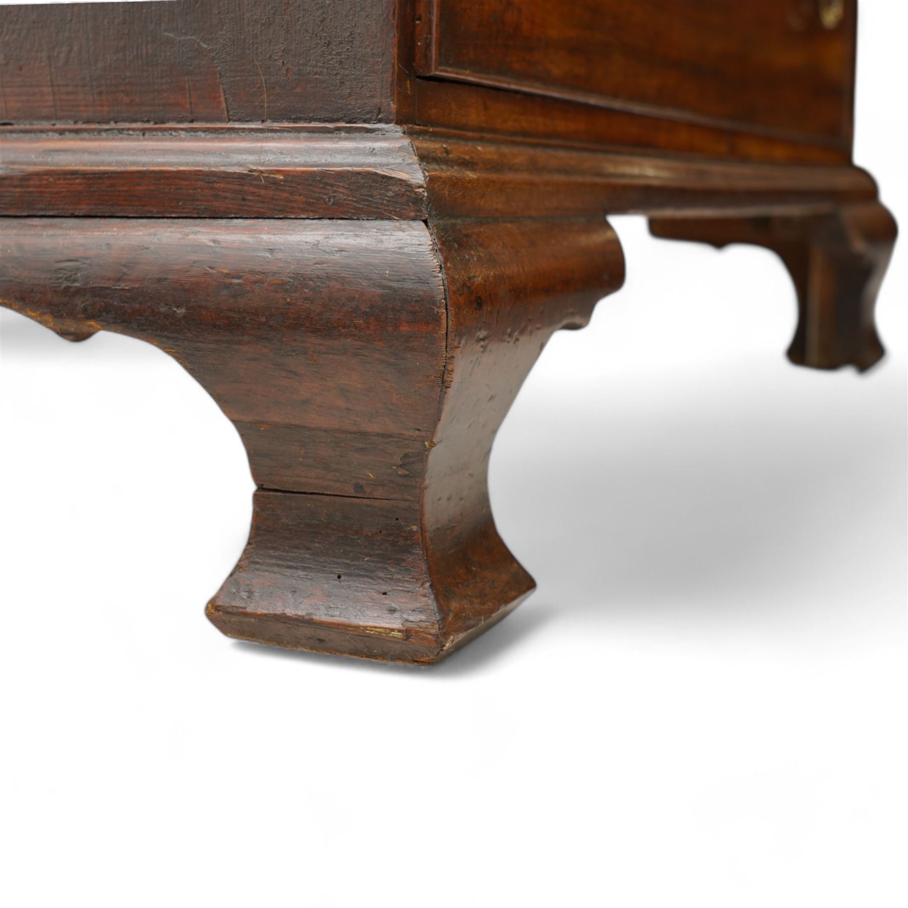 George III mahogany chest, moulded rectangular top over five long cock-beaded drawers, each fitted with brass swan neck handles and circular plates, with shaped brass escutcheons, lower moulding over ogee bracket feet 