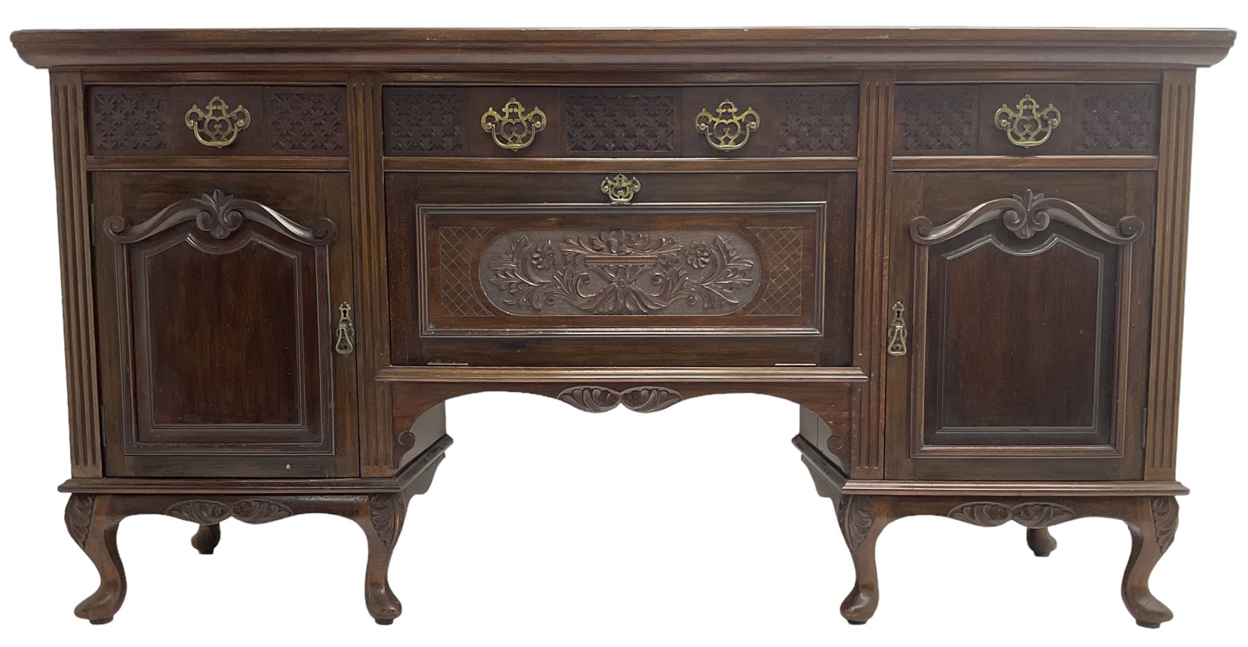 Late Victorian walnut sideboard, moulded rectangular top over three drawers  with blind fretwork facias, fitted with central fall front cupboard with extending foliage carved decoration and two flanking panelled cupboards, on acanthus carved cabriole feet