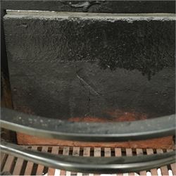 20th century Rococo style fire basket, cast iron back plate with pierced and scroll moulded cresting, steel fire bars and grate, ormolu mounted uprights with foliate scrollwork, on shaped feet