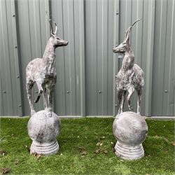 A pair of cast iron garden stag finials 